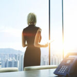 Back,View,Of,A,Businesswoman,With,Digital,Tablet,In,Hands