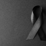 Black,Ribbon,On,Dark,Background,,Top,View,With,Space,For