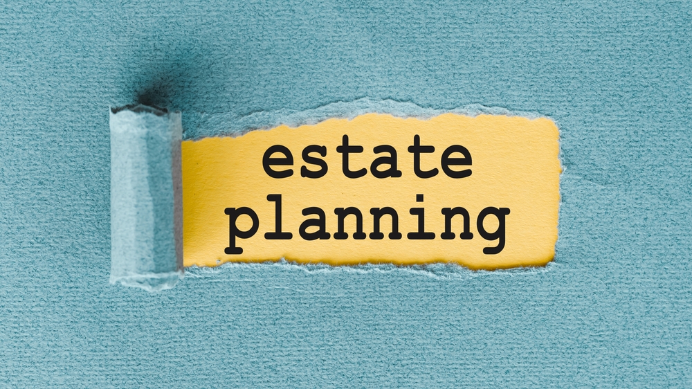 Estate,Planning,Written,On,Yellow,Paper,With,Torn,Edges