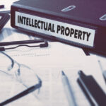 Office,Folder,With,Inscription,Intellectual,Property,On,Office,Desktop,With