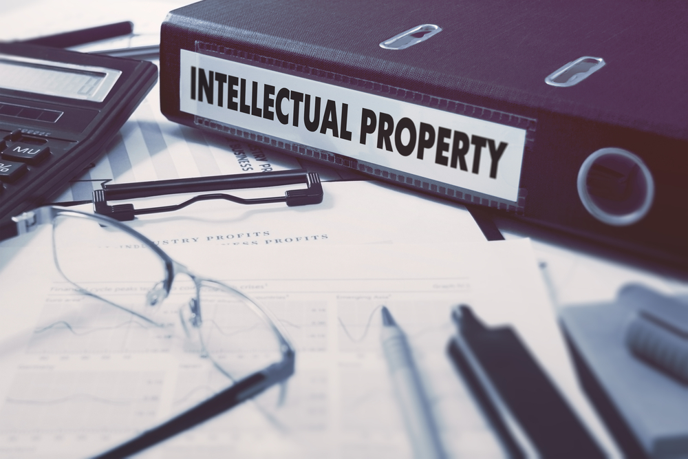 Office,Folder,With,Inscription,Intellectual,Property,On,Office,Desktop,With